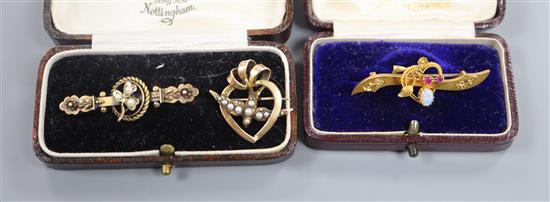 Three assorted early 20th century 15ct and gem set bar brooches including white opal and ruby, largest 42mm.